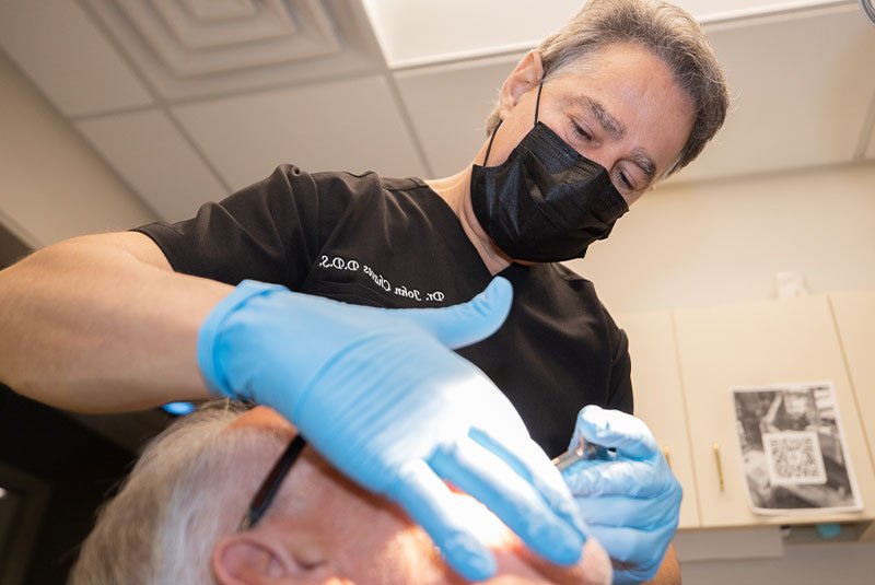 dentist performing treatment